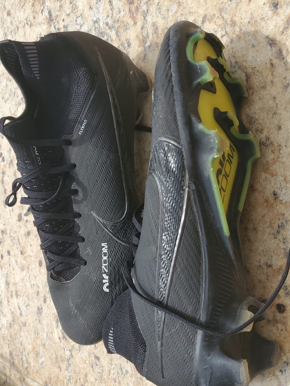 Nike Men’s Black Mercurial Football Cleats with Yellow-Sole Accents